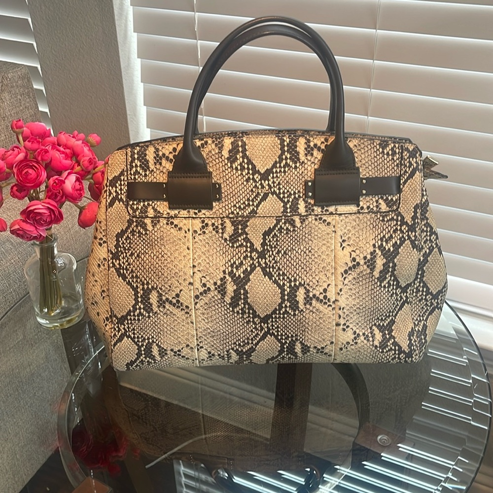 Furla snake pattern leather bag. It has small stains on the corners.